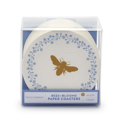 The Bee and Blooms Heavyweight Paper Coasters set includes 24 disposable coasters in a clear box, featuring a gold bee at the center and a blue floral border across four designs. Sizes available: one standard size per coaster.