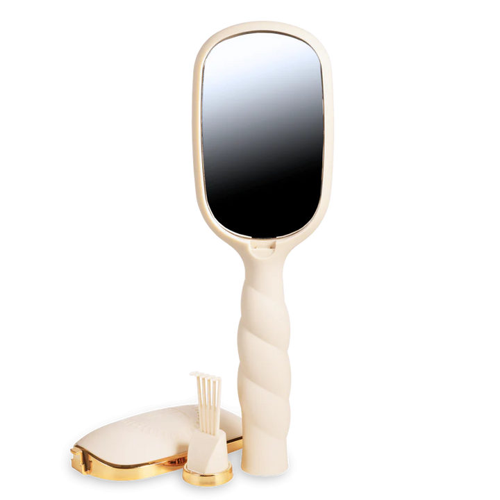 Teleties Hair Brush in cream with anti-static bristles, vented for easy detangling. Sizes: small, large. Twisted handle design.