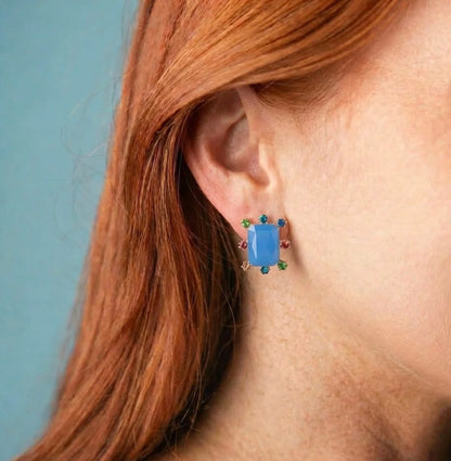 Rectangle Burst Stud Earrings with large rectangular blue stud and small multicolored gems around the edges; available in small, medium, and large sizes.
