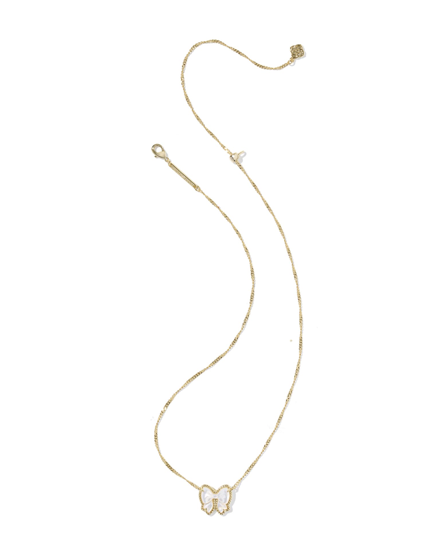 The Haley Bow Short Pendant Necklace by Kendra Scott features a reversible white and gold butterfly pendant. Available in one size.