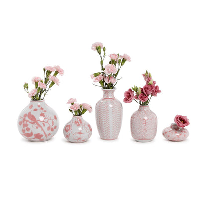 An arrangement of five hand-painted Pink Chinoiserie Vases in various sizes, each featuring pink floral patterns and filled with pink carnations. Sizes vary.