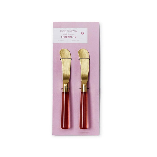 The Pink Blush Set of Two Spreaders features gold-colored, flat, rounded blades and red acrylic stainless steel handles. Available sizes: N/A.