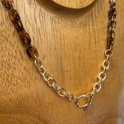 Eva Tortoise Toggle Necklace with gold and dark amber-colored chain links, front toggle clasp; available in 16", 18", and 20" lengths.