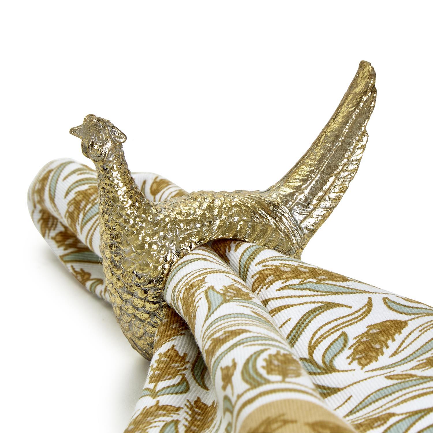 Golden Pheasant Napkin Ring - Brass bird with textured feathers and a curved tail, ideal for fall-themed table settings. Sizes: One size fits all.