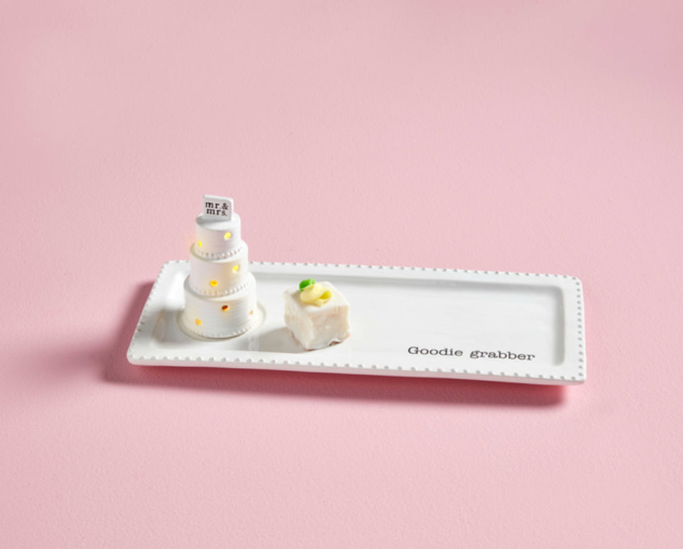 Wedding Cake Light-up &amp; Sound Sitter with “Mr &amp; Mrs” topper on a white plate. Available in multiple sizes.