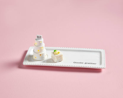 Wedding Cake Light-up & Sound Sitter with “Mr & Mrs” topper on a white plate. Available in multiple sizes.