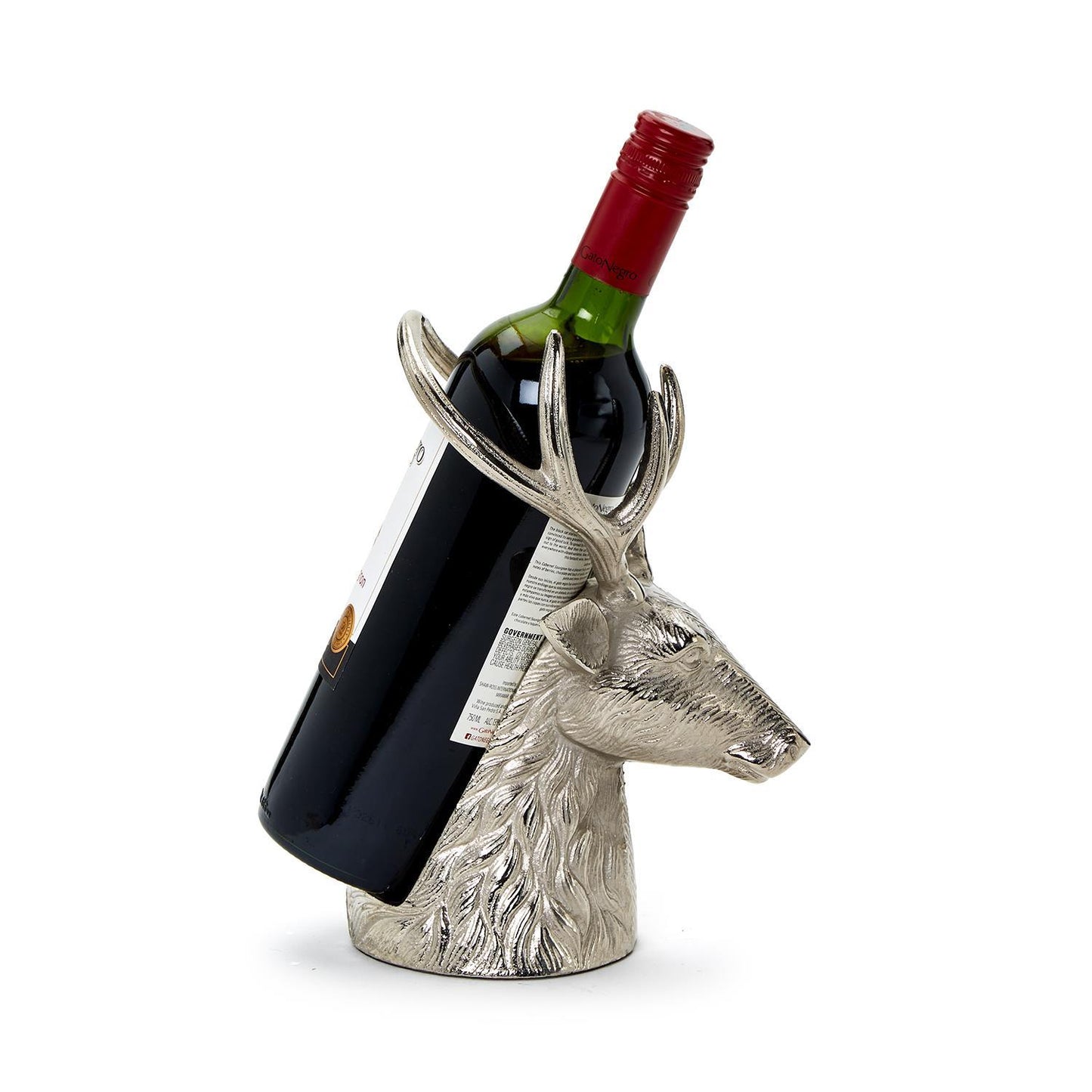 The Silver Stag Bottle Holder features a silver deer head with detailed antlers, supporting a wine bottle at an angle. Available size: One size fits most standard wine bottles.