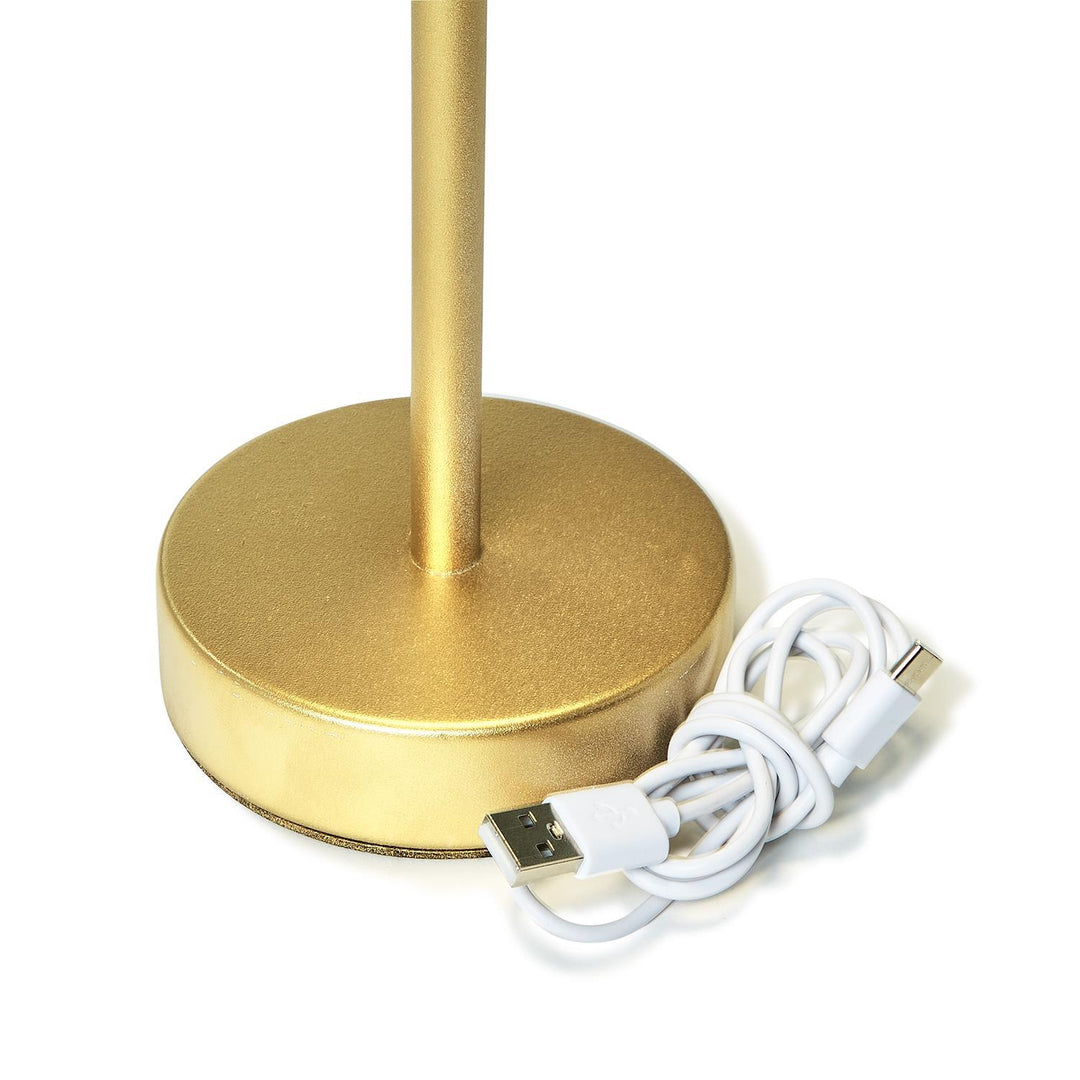 Gold-colored LED cordless table lamp with scalloped edge shade. Includes USB charging cable. Available in sizes: Small, Medium, Large.