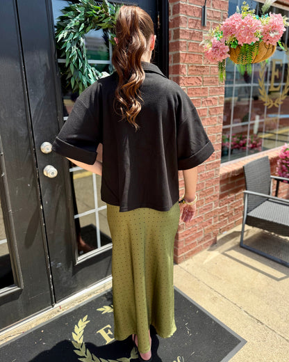 Polka Dot Satin Skirt in olive green with subtle pattern, available in sizes XS–XL.