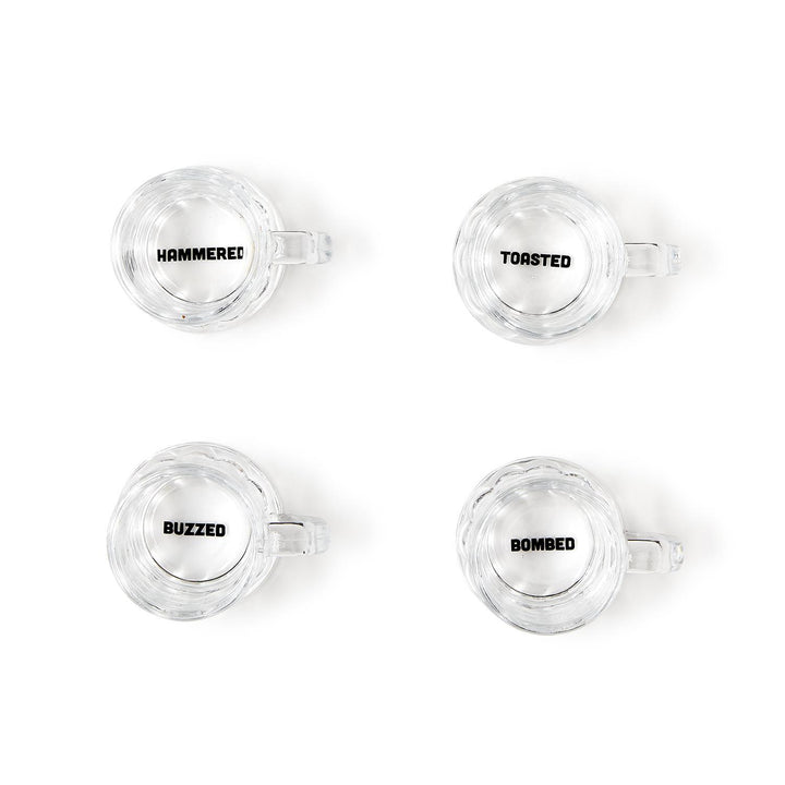 Set of four clear shot glasses labeled "HAMMERED," "TOASTED," "BUZZED," and "BOMBED." Each holds 2 oz. Gift box included.