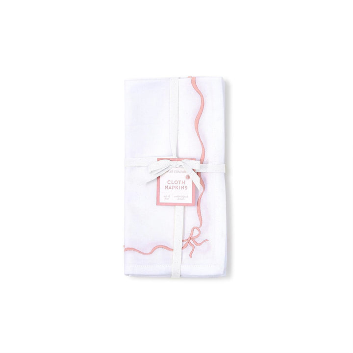 Set of 4 white cotton napkins with pink wavy borders and white ribbon. Size: standard dinner napkin.