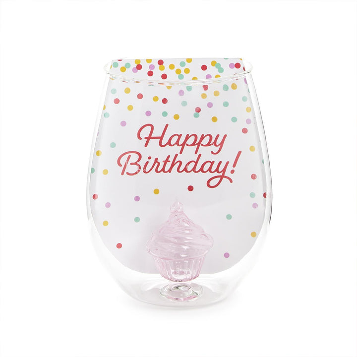The Celebration Cake Stemless Wine Glass features a clear design with multicolored polka dots and "Happy Birthday!" in red script. A pink, cake-shaped decoration at the bottom adds charm to this 20 oz. capacity wine glass.