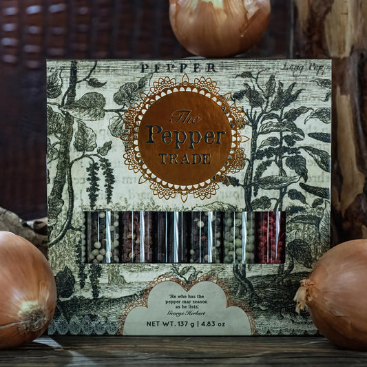 The "Pepper Trade 8 Tube Gift Set" includes a collection of gourmet peppercorns in transparent tubes, packaged with vintage botanical illustrations.