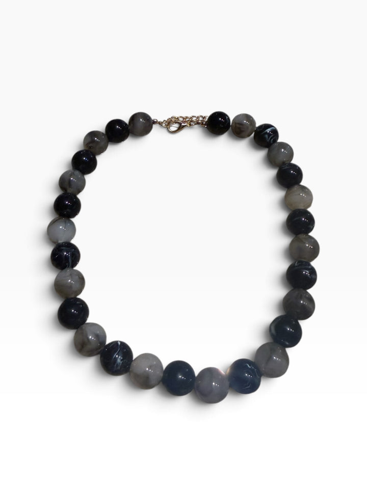 Mixed Color Beaded Necklace with round, marbled grey and black beads and gold-tone clasp. Available in various sizes.