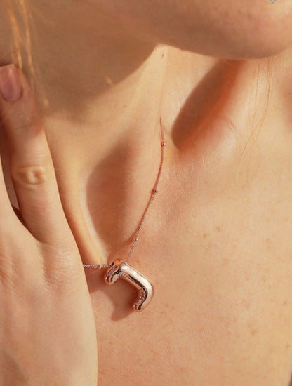 The Personalized Bubble Balloon Initial Necklace features a unique pendant. Available in multiple sizes.