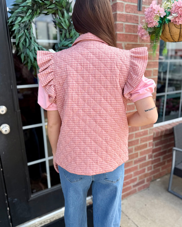 Blush gingham puffer vest, available in sizes XS-XL.