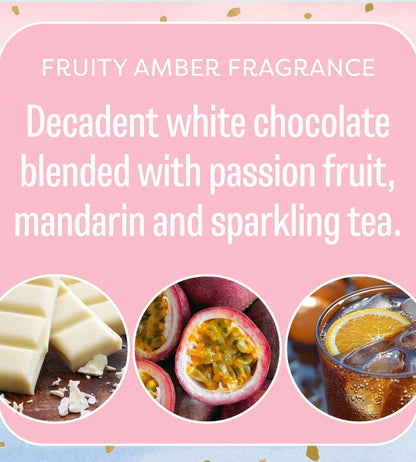 Little Sparkle Scented Sachet features a pink label describing its fragrance as white chocolate, passion fruit, mandarin, and sparkling tea, with corresponding images on the packaging. Available in multiple sizes.