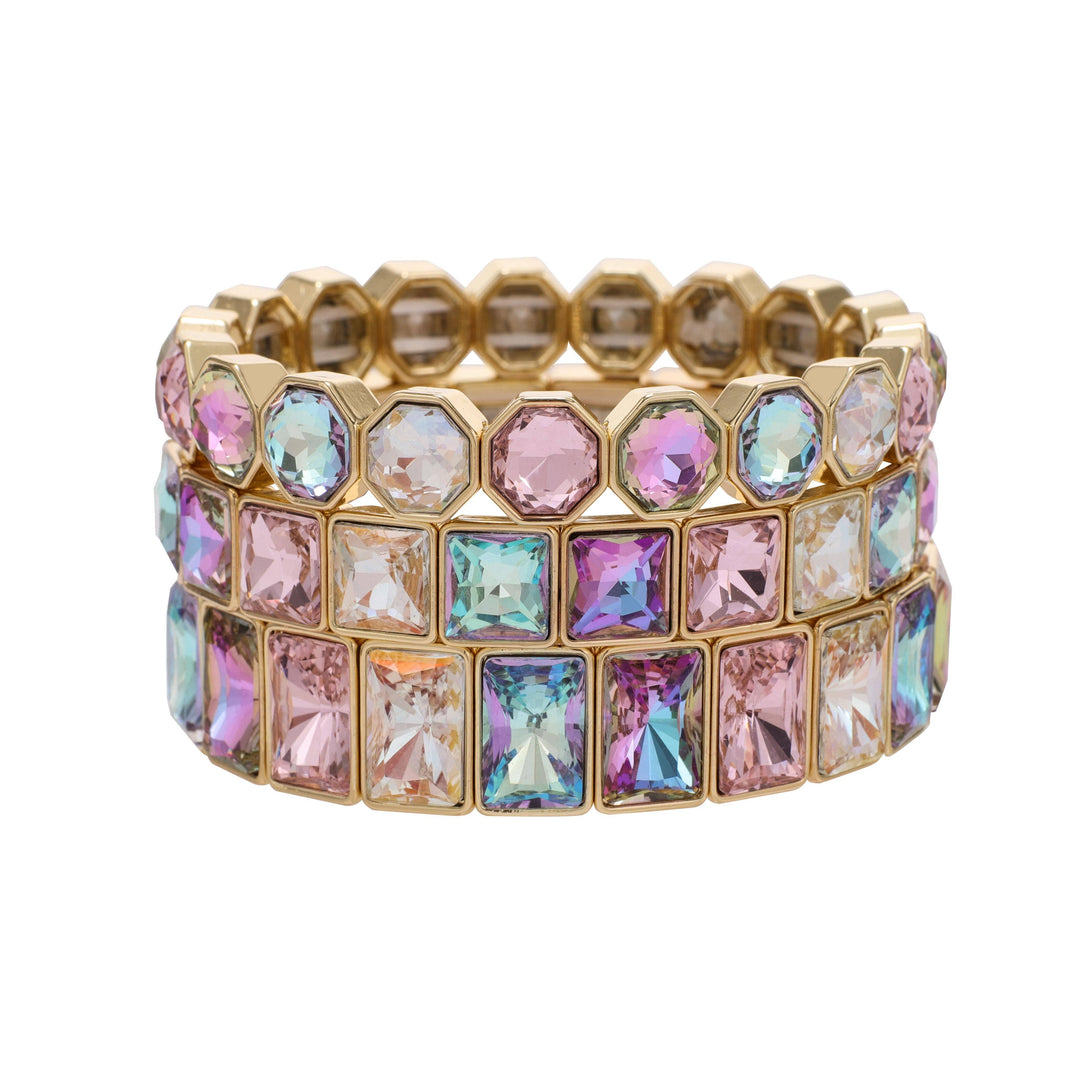 Gold tone stretch bracelet with two rows of large pastel crystals in square and octagonal cuts. Sizes: S, M, L.