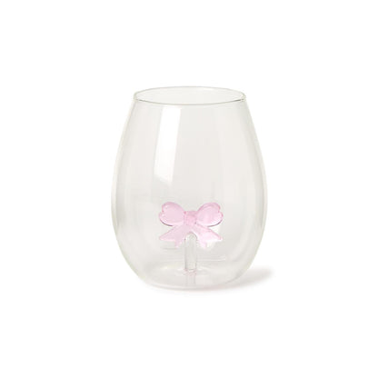 The Bow Stemless Wine Glass features a teardrop shape with a smooth surface and a unique double-walled design showcasing a pink bow. Sizes available: 12 oz.