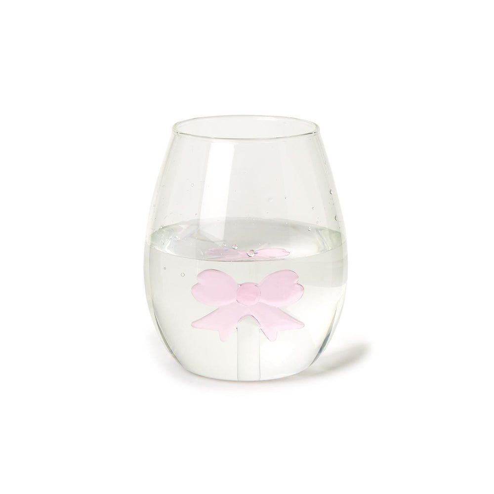 The Bow Stemless Wine Glass, highlighted by a pink bow-shaped ice cube, offers elegance and sophistication. Available sizes: 12 oz, 16 oz.