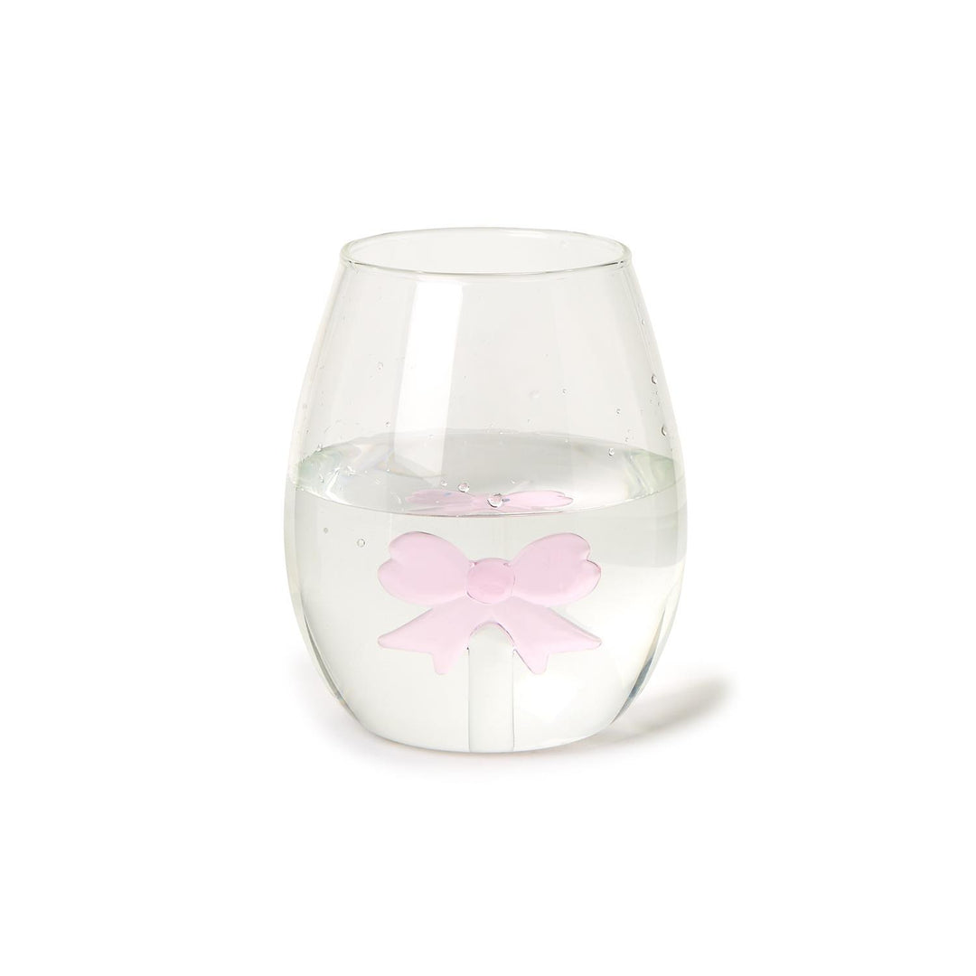 The Bow Stemless Wine Glass, highlighted by a pink bow-shaped ice cube, offers elegance and sophistication. Available sizes: 12 oz, 16 oz.