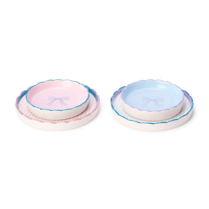 Set of 2 scallop edge trinket dishes featuring a bowl and plate. One in pastel pink with ribbon motif, the other in pastel blue.