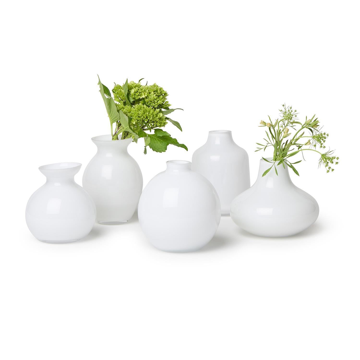 Set of five milk white glass vases in assorted shapes and sizes. Available in small, medium, and large.