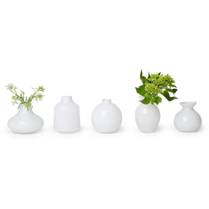 Five milk white glass vases, available in multiple sizes. Simple, minimalist design. Set includes five pieces.