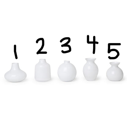 Set of five milk white glass vases in assorted shapes and heights, numbered 1–5. Sizes vary from small to tall.