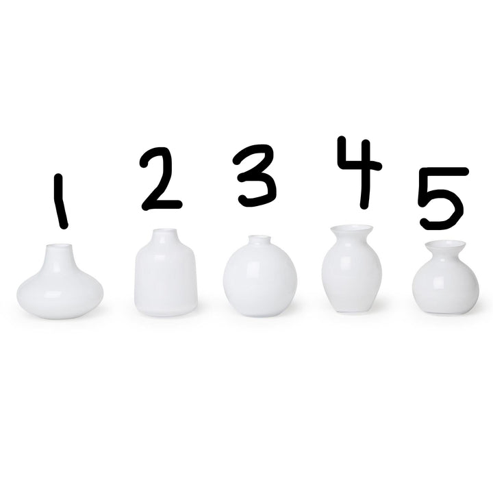 Set of five milk white glass vases in assorted shapes and heights, numbered 1–5. Sizes vary from small to tall.