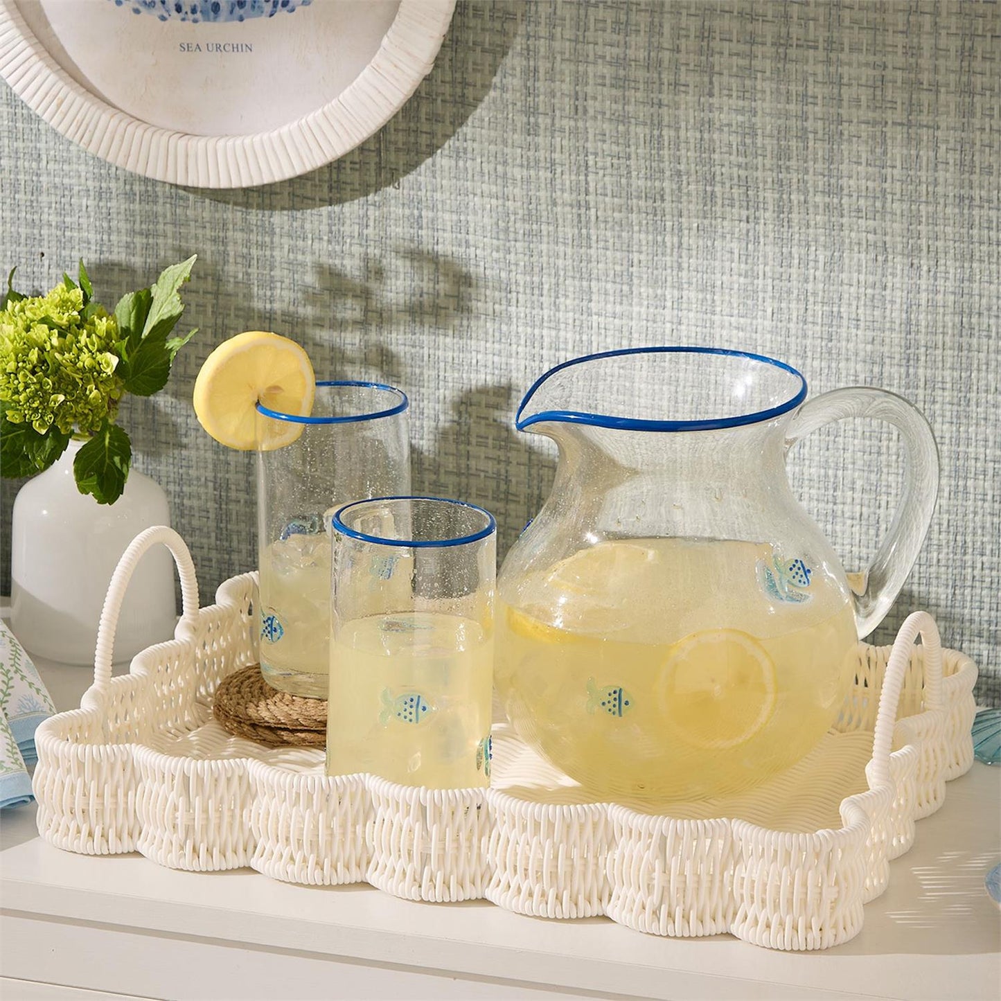 All-Weather Wicker Scalloped Edge Serving Tray with Handles, available in small (18") and large (22") sizes.