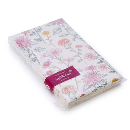 Botanica Dinner Napkin/Guest Towel with pink, yellow, green florals in clear plastic wrap, maroon label. Available in one size.