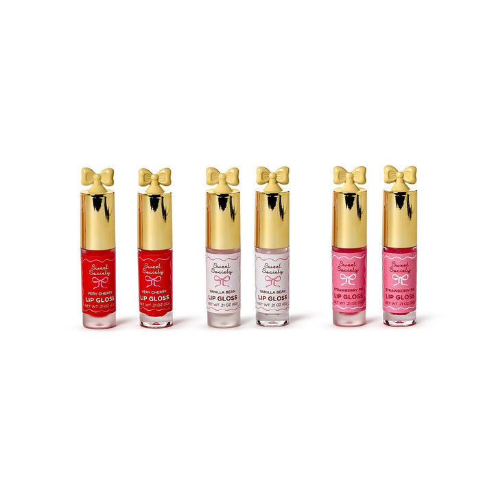 Six Sweet Society Pretty Bow Lip Gloss, 6 tubes, 3 shades/scents, gold bow caps, clear bodies. Sizes: 4ml and 8ml.