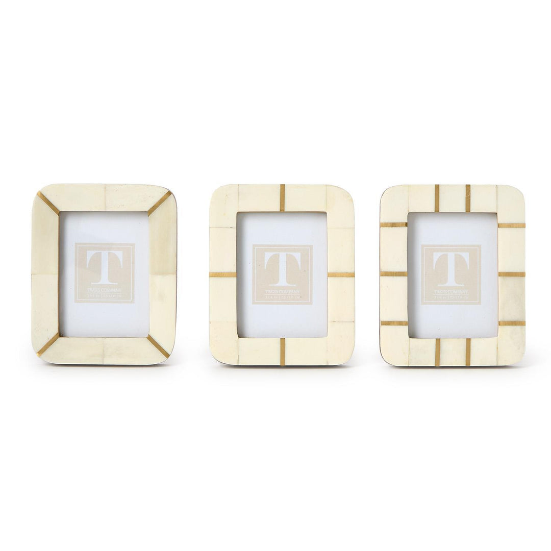 Three 3x4 mini photo frames, cream with gold accents and geometric lines, in a simple bone-and-brass modern design.