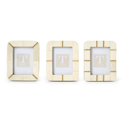 Three 3x4 mini photo frames, cream with gold accents and geometric lines, in a simple bone-and-brass modern design.