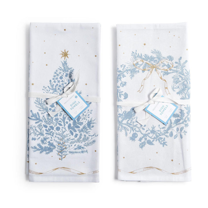 Two folded Gilded Cottage Dish Towels with blue and gold holiday patterns, tied with ribbon and tags.