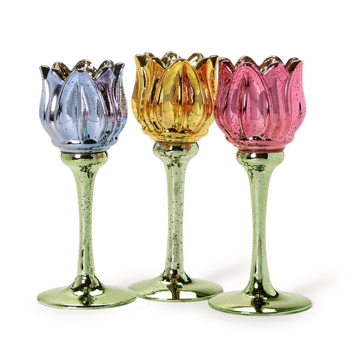 Set of three tulip stemmed tealight candleholders in blue, gold, and pink with green bases. Available in small, medium, large.