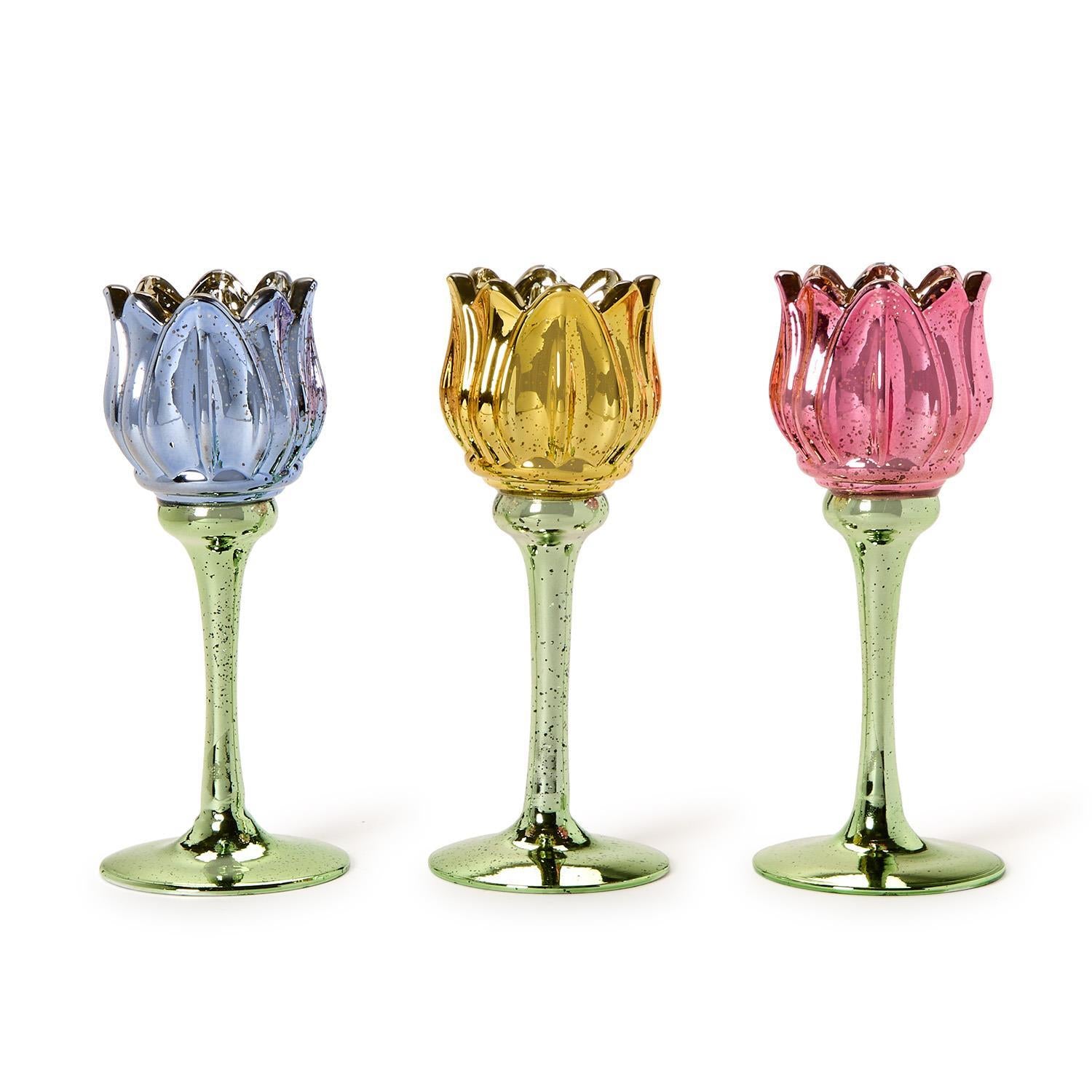 Set of three tulip stemmed tealight candleholders in blue, yellow, and pink with green stems and bases. Available in S, M, L.