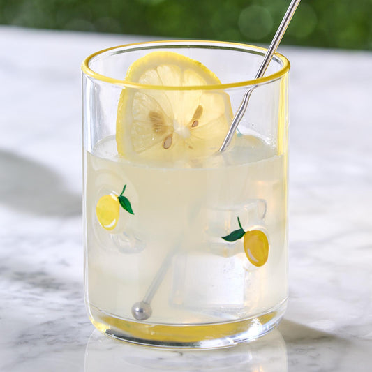 Lemon Double Old Fashion Hand-Painted Glass shown with lemon slice. Available in 13 oz and 16 oz sizes.