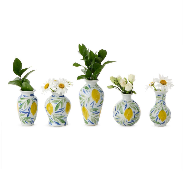 Hand-painted mini lemon vases with unique blooms and greenery. Available in sets of five; each vase measures 3" tall.