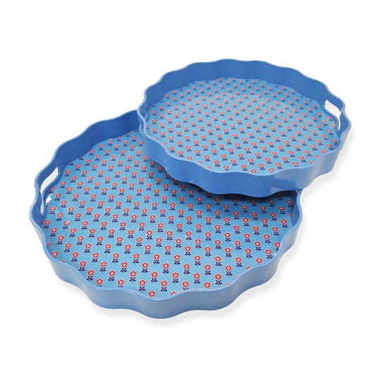 Red, White and Bloom scalloped lacquered trays in two stackable sizes with blue edges, cutout handles, floral interior.
