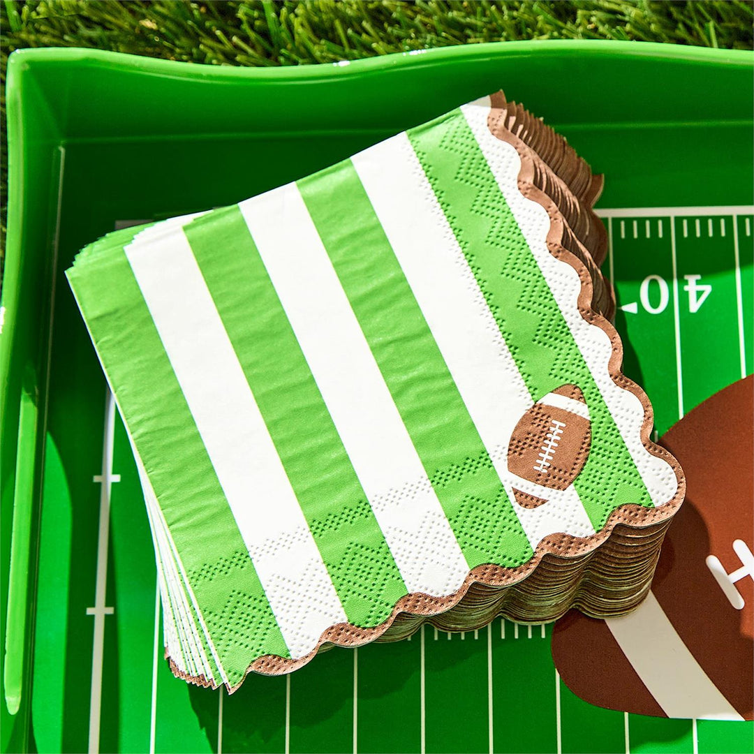 Game Day 3-Ply Scalloped Edge Paper Napkins with green and white stripes and a football design, available in multiple sizes.