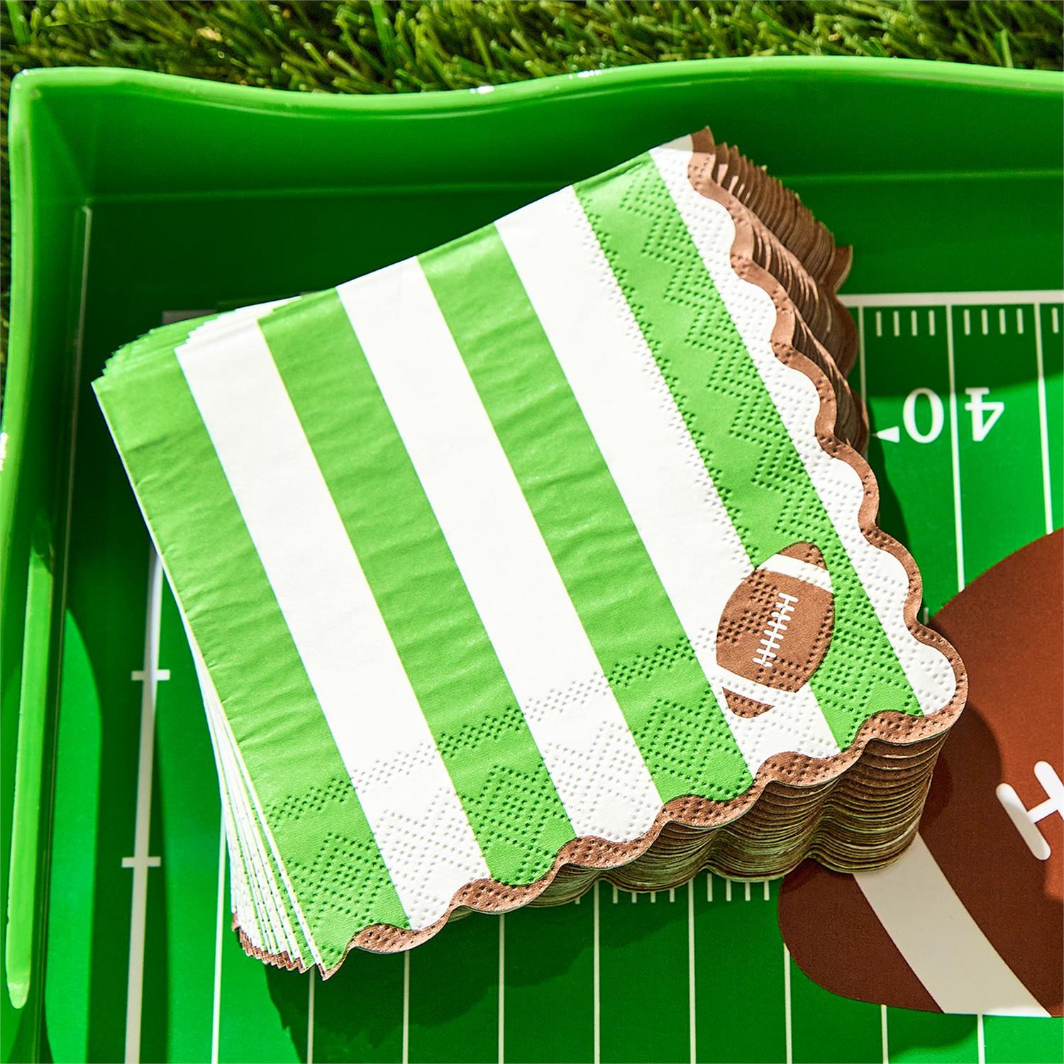 Game Day 3-Ply Scalloped Edge Paper Napkins with green and white stripes and a football design, available in multiple sizes.