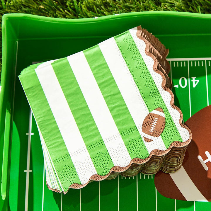 Game Day 3-Ply Scalloped Edge Paper Napkins with green and white stripes and a football design, available in multiple sizes.