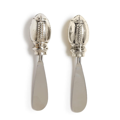 Set of 2 metal spreader knives with American football-shaped handles. No size information available.