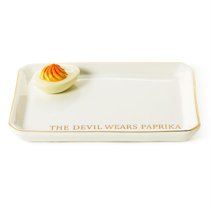 White ceramic tray with gold trim, deviled egg detail, "THE DEVIL WEARS PAPRIKA" in gold. Gift boxed. Sizes: one size.