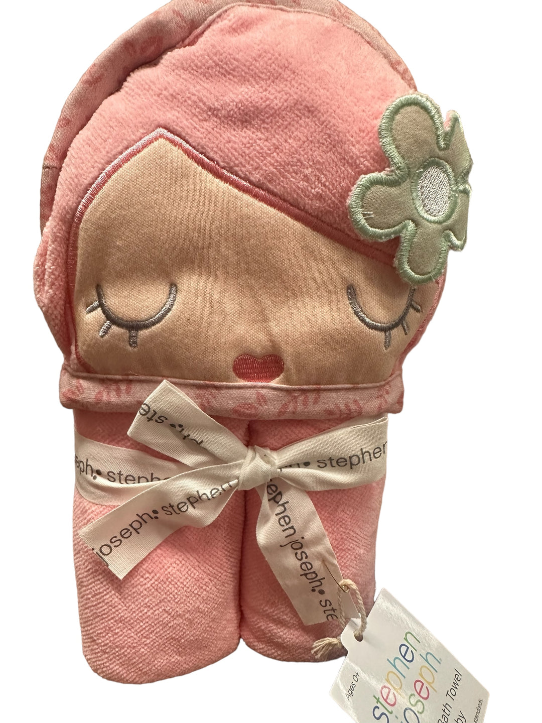 Pink Hooded Bath Towel with doll face, closed eyes, rosy cheeks, flower detail; tied with "stephen joseph" ribbon. Sizes: S/M/L.