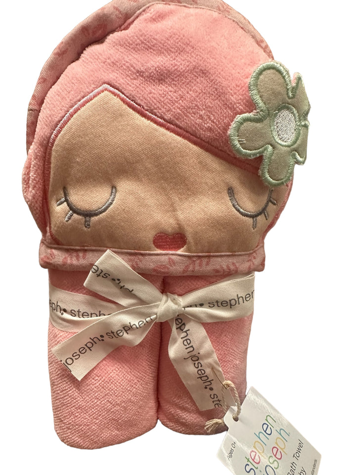 Pink Hooded Bath Towel with doll face, closed eyes, rosy cheeks, flower detail; tied with "stephen joseph" ribbon. Sizes: S/M/L.