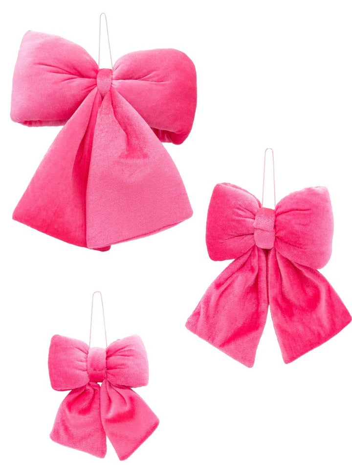 Three pink velvet bows in varying sizes with wire hanging loops.