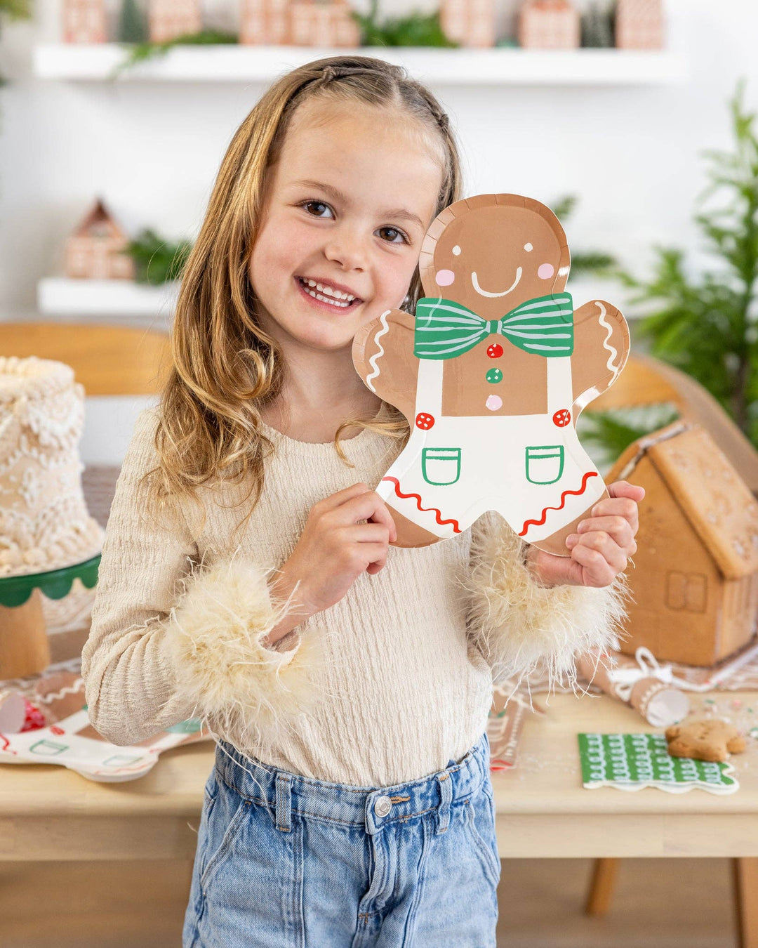 Gingerbread Man Plate shaped as a die-cut gingerbread man with a green striped bowtie and white overalls with red trim.